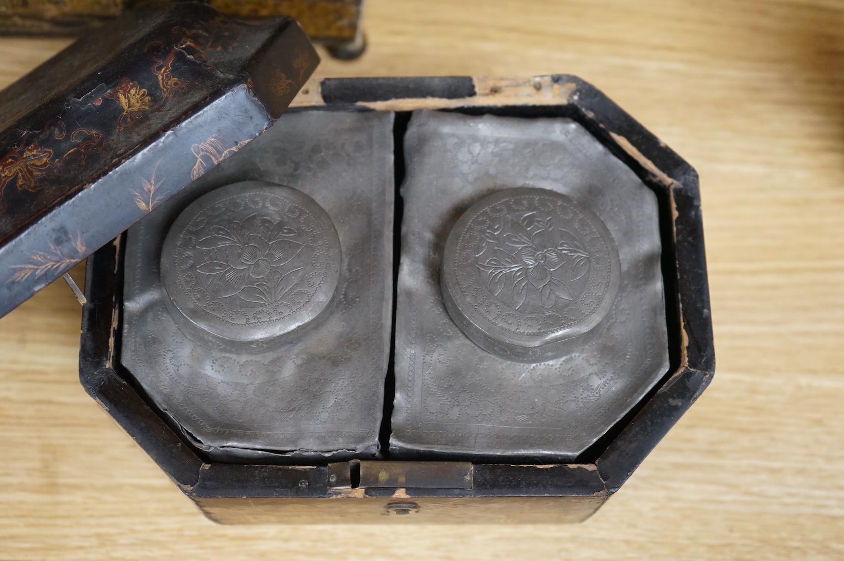 A Chinese lacquer tea caddy and a japanned sewing box (2)